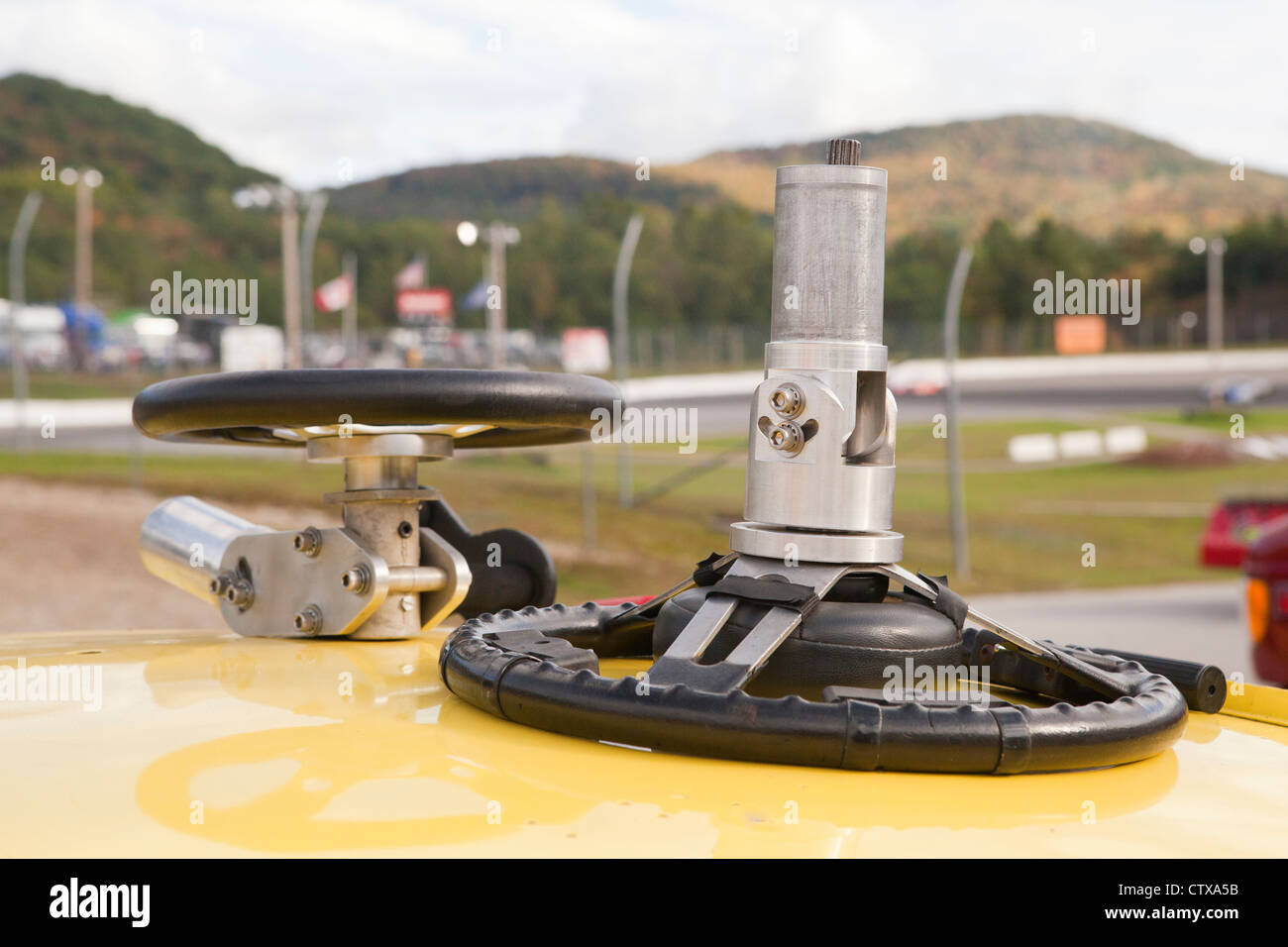 Practice wheel for hand controlled simulator on the top of a stock car for racing Stock Photo