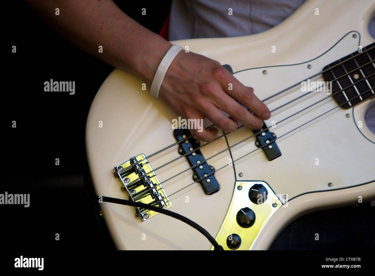 A Fender Jazz bass guitar is played on stage Stock Photo - Alamy