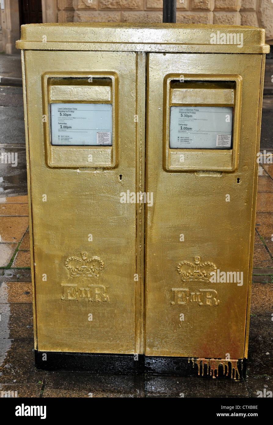 Royal Mail hastily gold painted postbox on Upper High Street