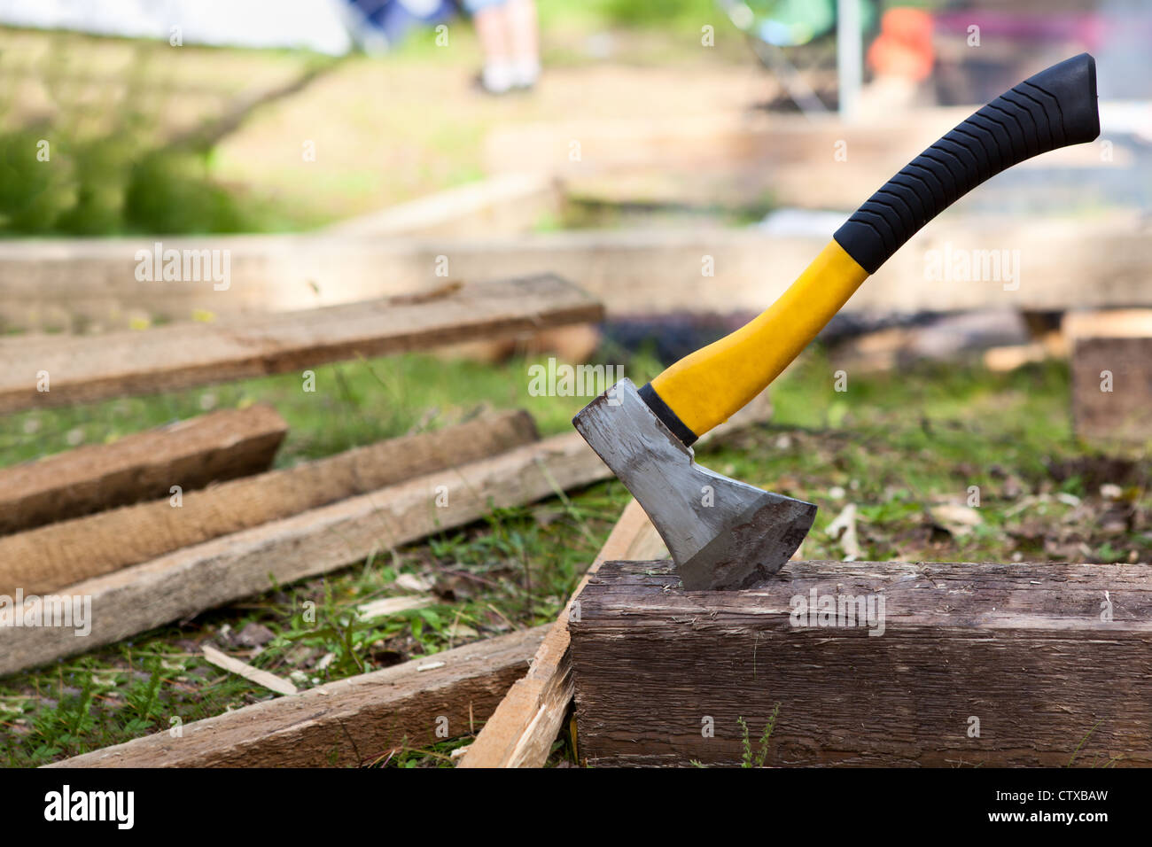 Axe in the block at the construction site Stock Photo - Alamy