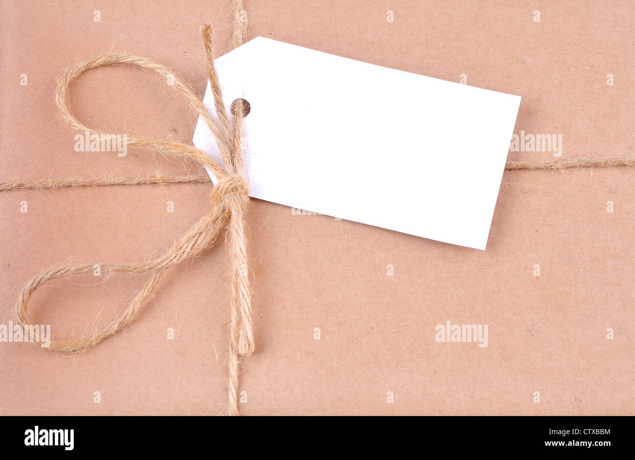Wlhite blank label on a parcel post Stock Photo