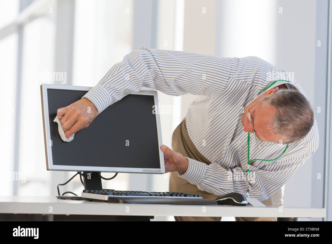 Administrator cleaning a computer screen Stock Photo Alamy