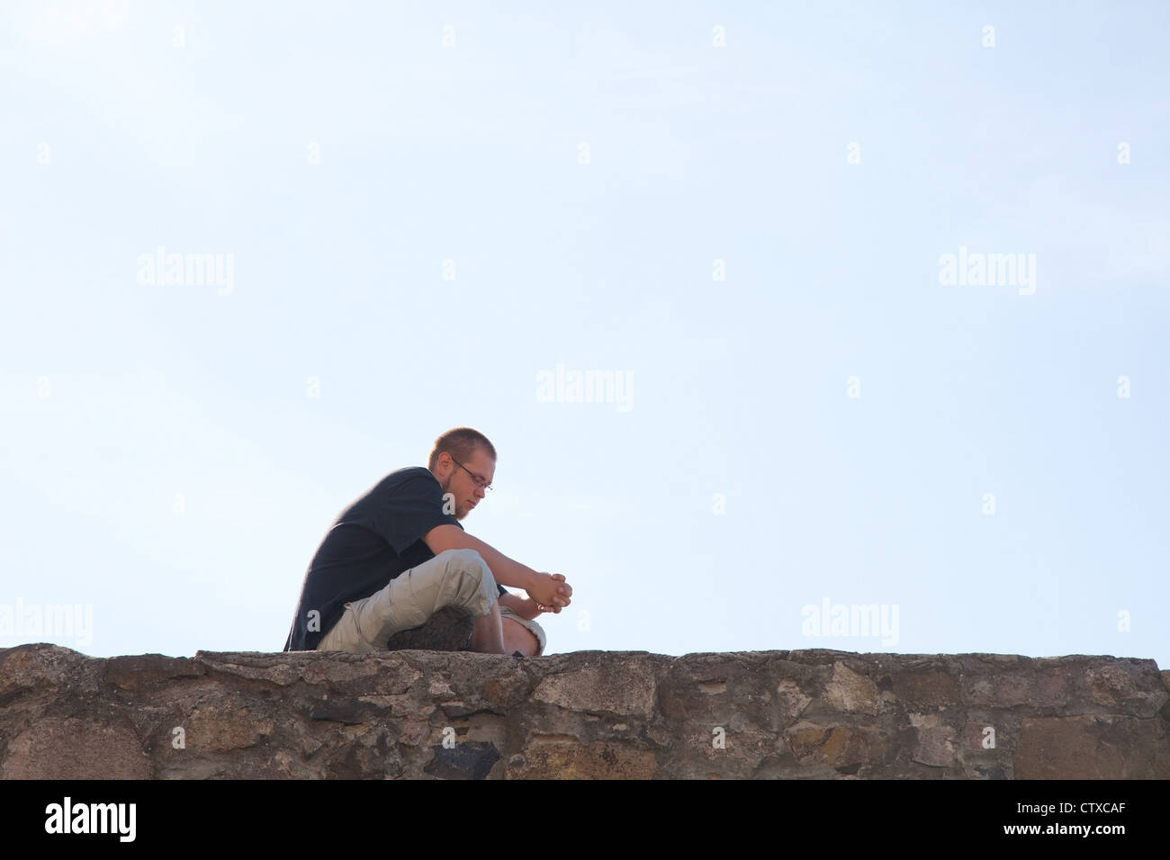 Sad man sitting hi-res stock photography and images - Alamy