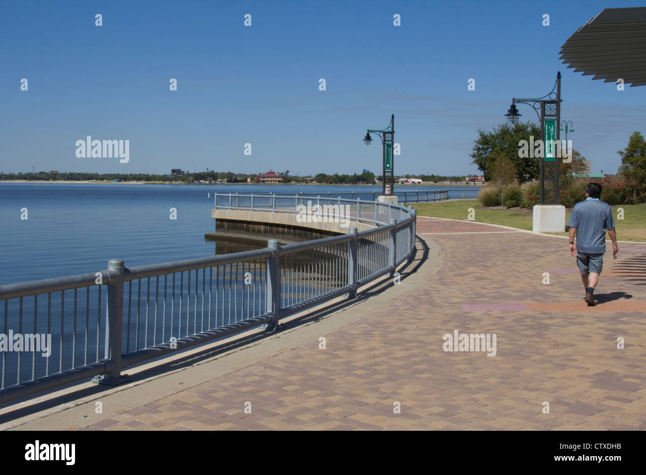 Lakefront Promenade, complete with custom lighting and seating, skirts Lake Charles near downtown Lake Charles, LA, USA Stock Photo
