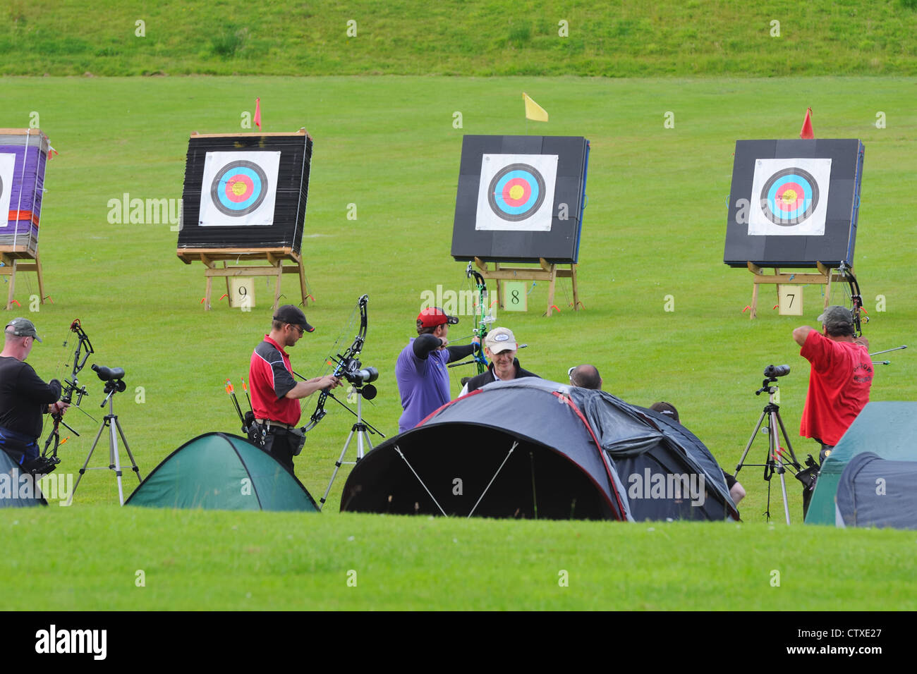 Members of the Glasgow Archers club with tented shelters and targets in Scotland, UK Stock Photo