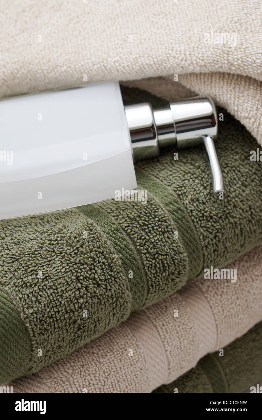 Bath Towels and Soap Dispenser Stock Photo