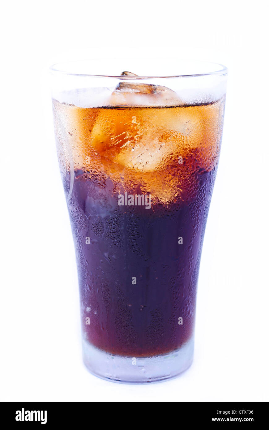 Glass filled with ice cubes and Cola soda over a white background Stock ...