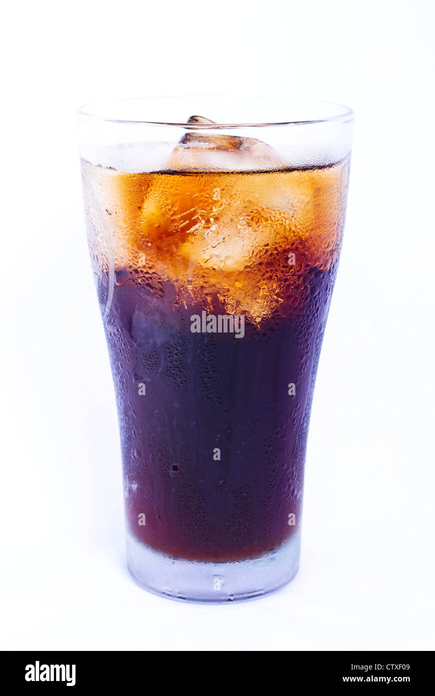 Glass filled with ice cubes and Cola soda over a white background Stock ...