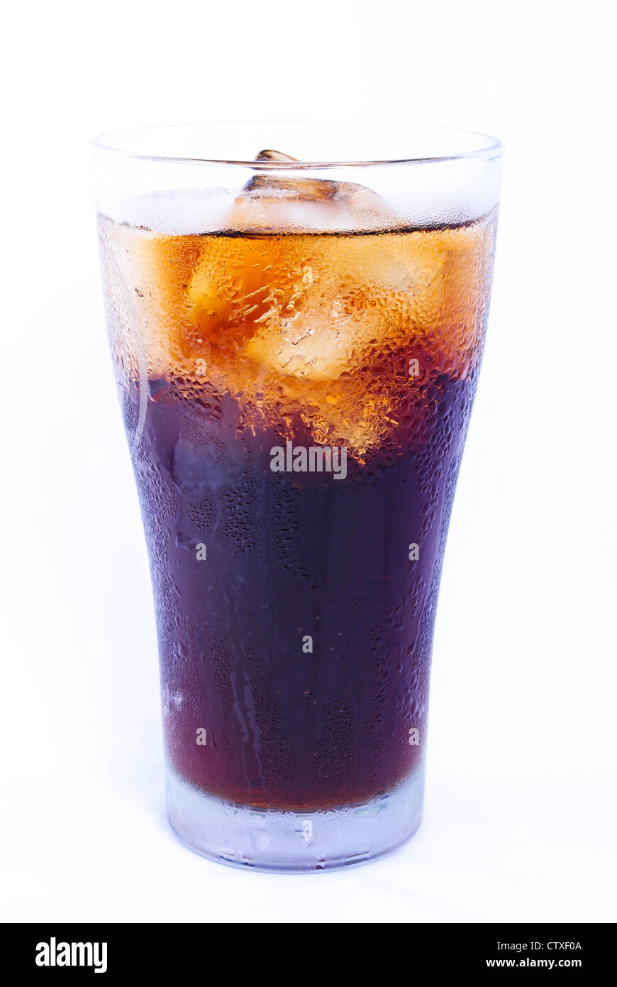 Glass filled with ice cubes and Cola soda over a white background Stock ...