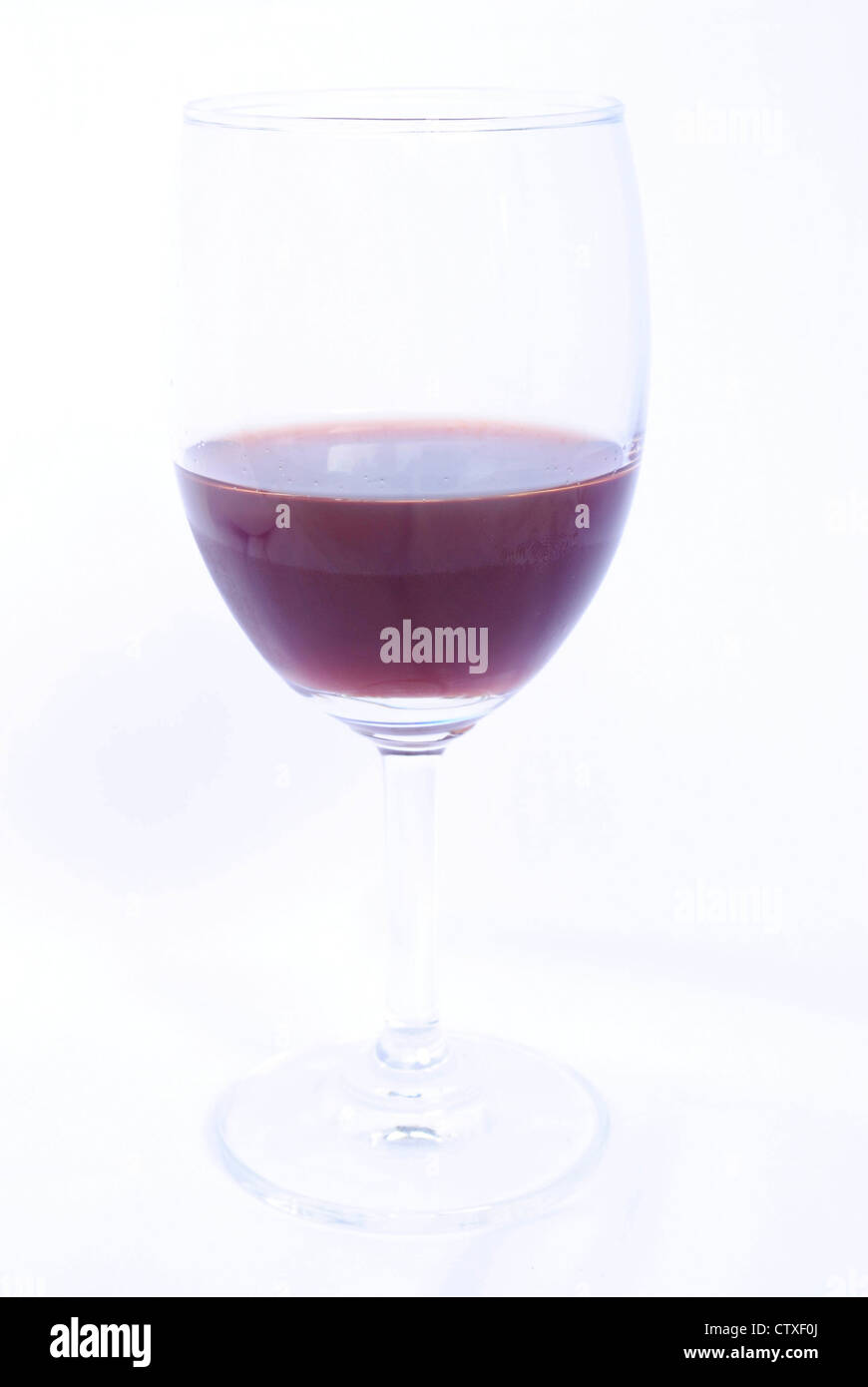 Glass of red wine on a white background Stock Photo - Alamy