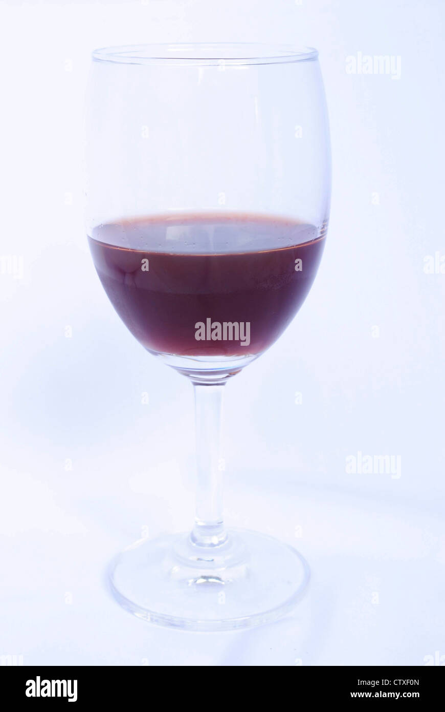 Glass of red wine on a white background Stock Photo - Alamy
