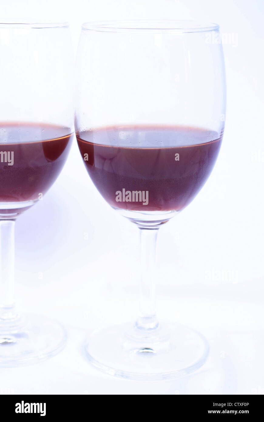 Glass of red wine on a white background Stock Photo - Alamy