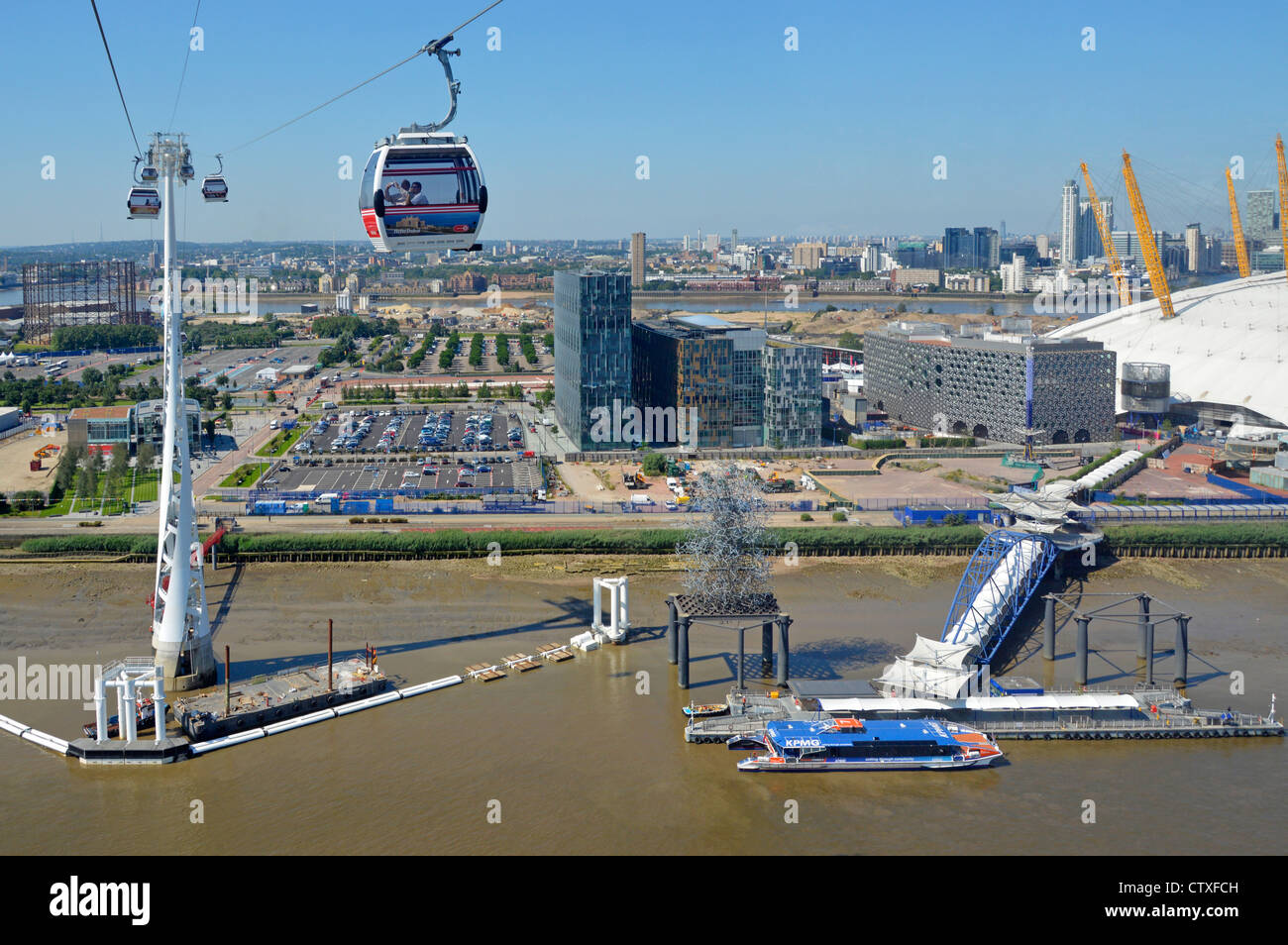 Aerial view of North Greenwich Pier & peninsula with moored Thames Clipper boat all adjacent to the o2 arena 02 millenium dome Stock Photo