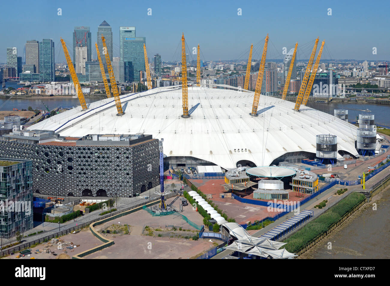 Aerial view O2 dome arena London 2012 Olympic venue on the Greenwich Peninsula with Canary Wharf banking skyline beyond Stock Photo
