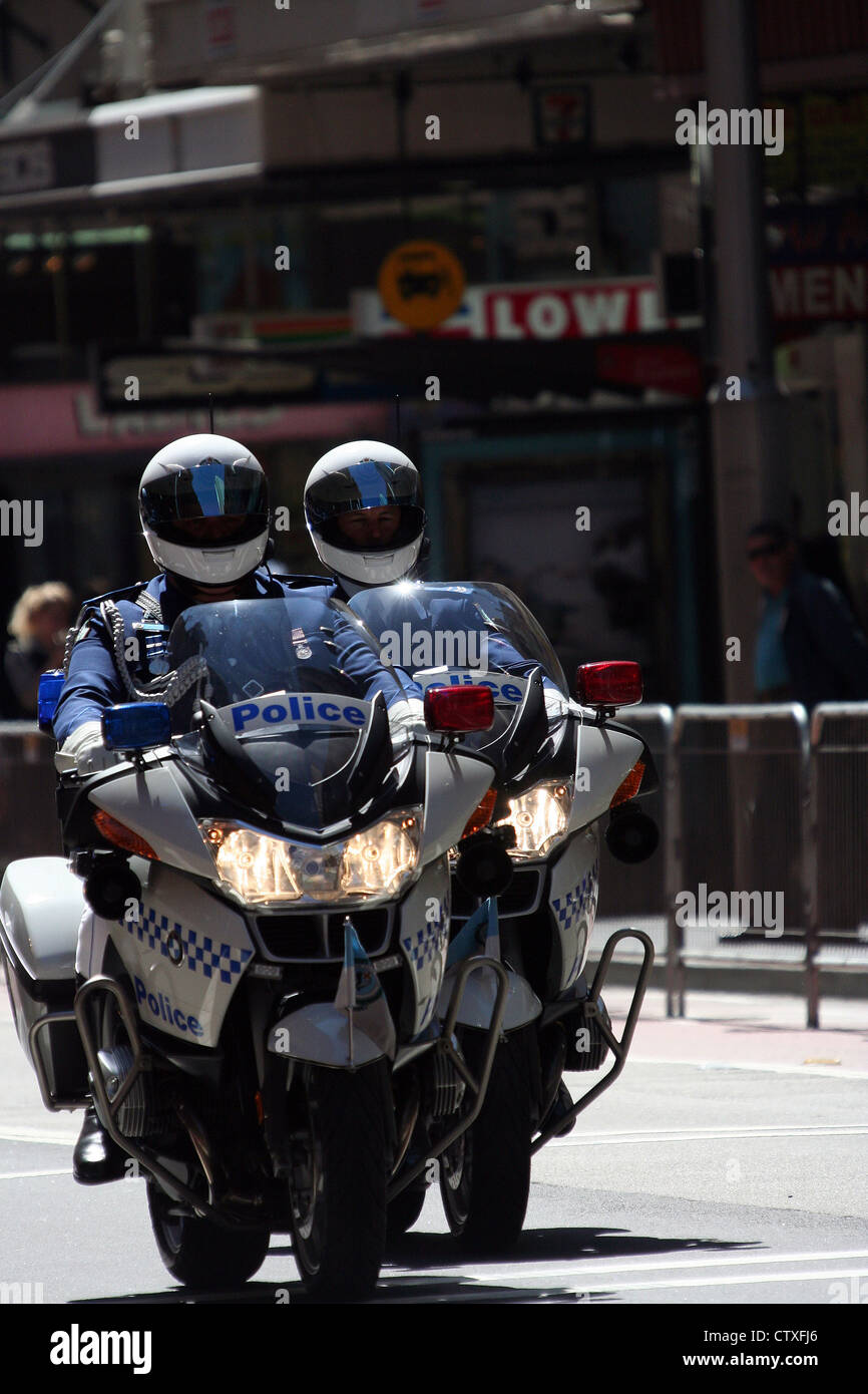 Two motorcycle policeman lead the 2008 Olympians return home parade through the streets of Sydney, Australia. Stock Photo