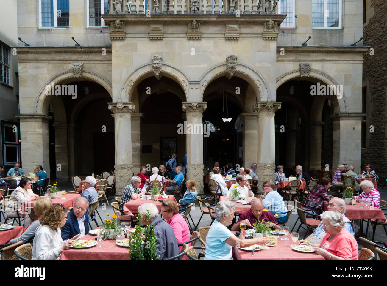 Busy street cafe on Prinzipalmarkt in central Munster Germany Stock Photo