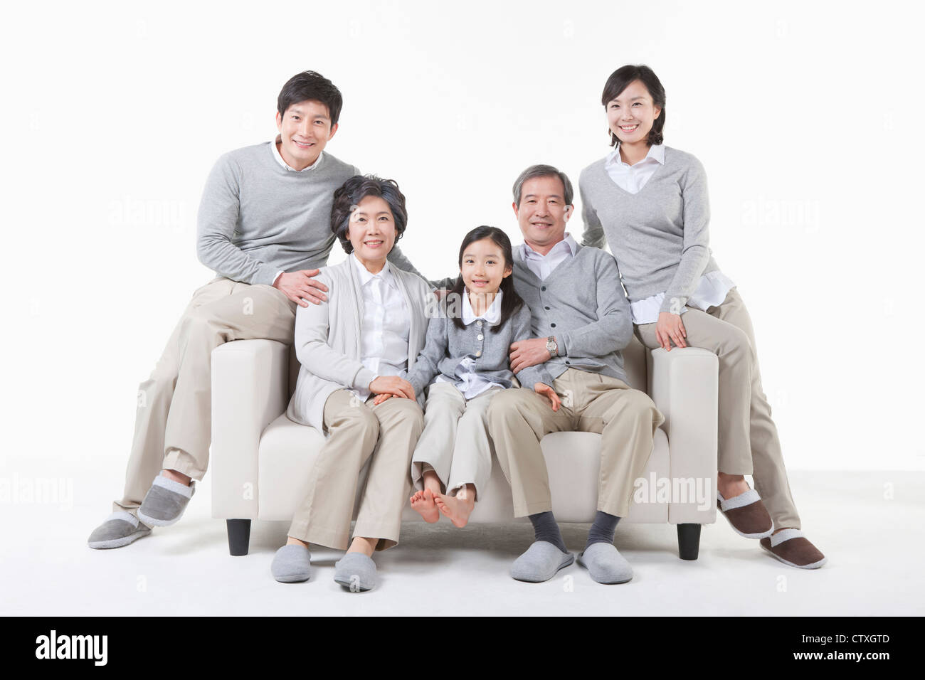 A large family around the couch Stock Photo - Alamy
