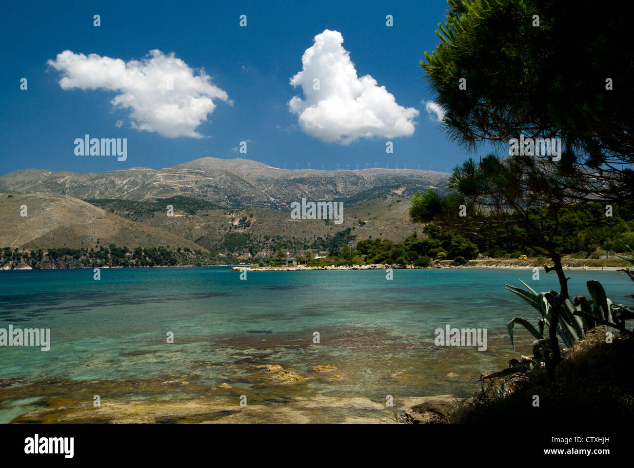 Beach with mountains in distance, Fanari, Argostoli, Kefalonia, Ionian Islands, Greece. Stock Photo