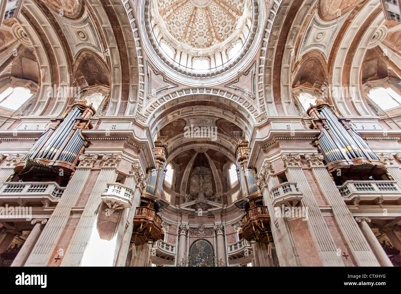 Four of the six organs and dome of the Basilica of the Mafra Palace and Convent in Portugal. Baroque architecture. Stock Photo