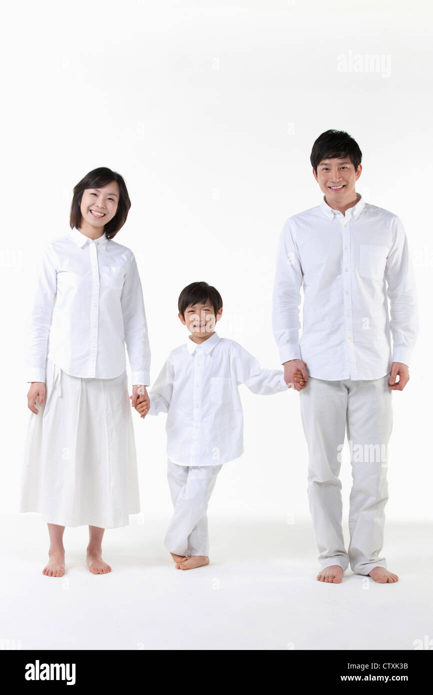 A family holding hands together Stock Photo - Alamy
