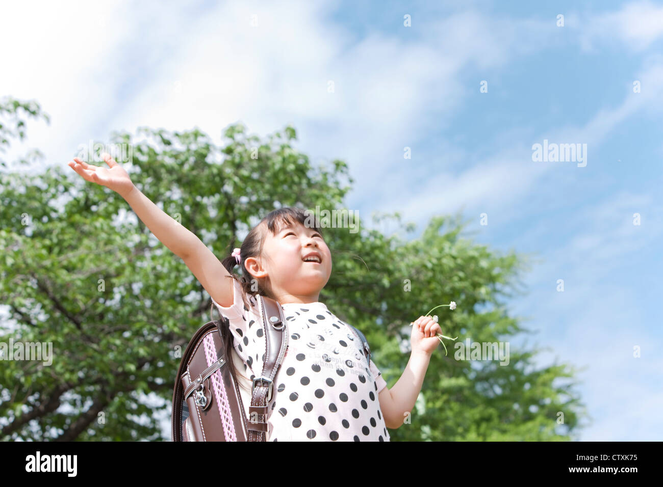 A girl carrying a school bag Stock Photo Alamy