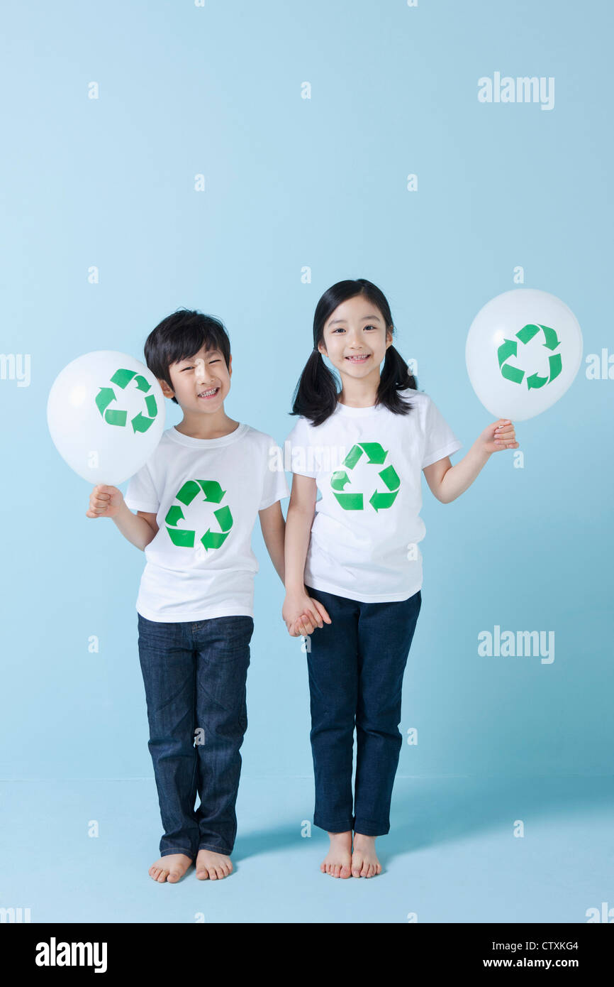 Children holding recycling balloons Stock Photo Alamy