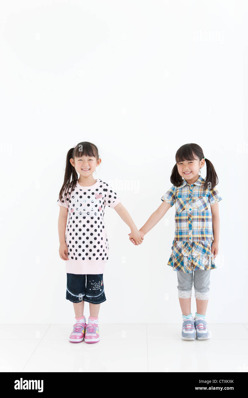 Two girls two girls Cut Out Stock Images & Pictures - Alamy