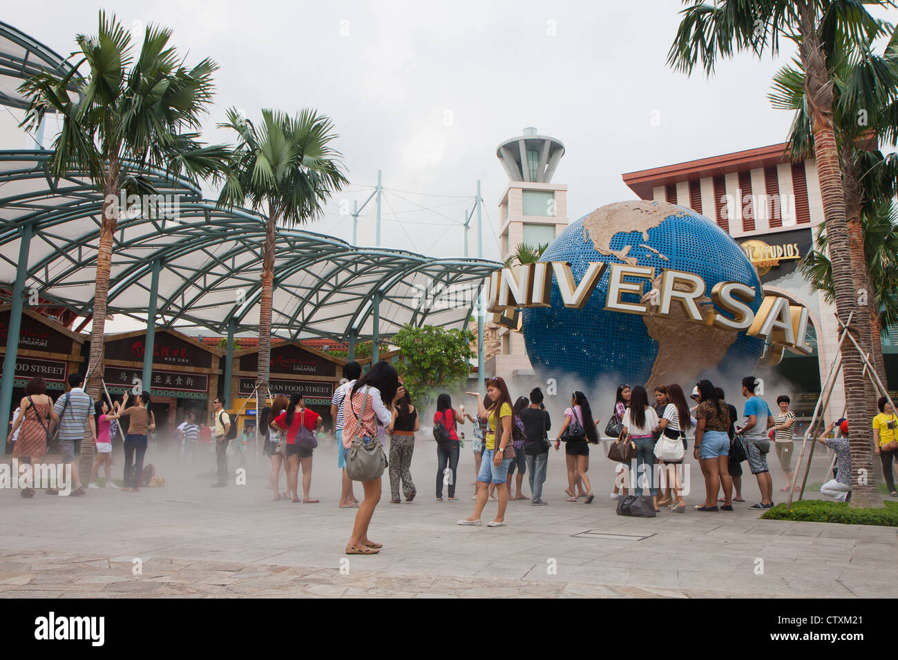 Singapore March 12 Tourists Posing Near Universal Studios Logo And Trademark In Sentosa Resorts World Singapore Stock Photo Alamy