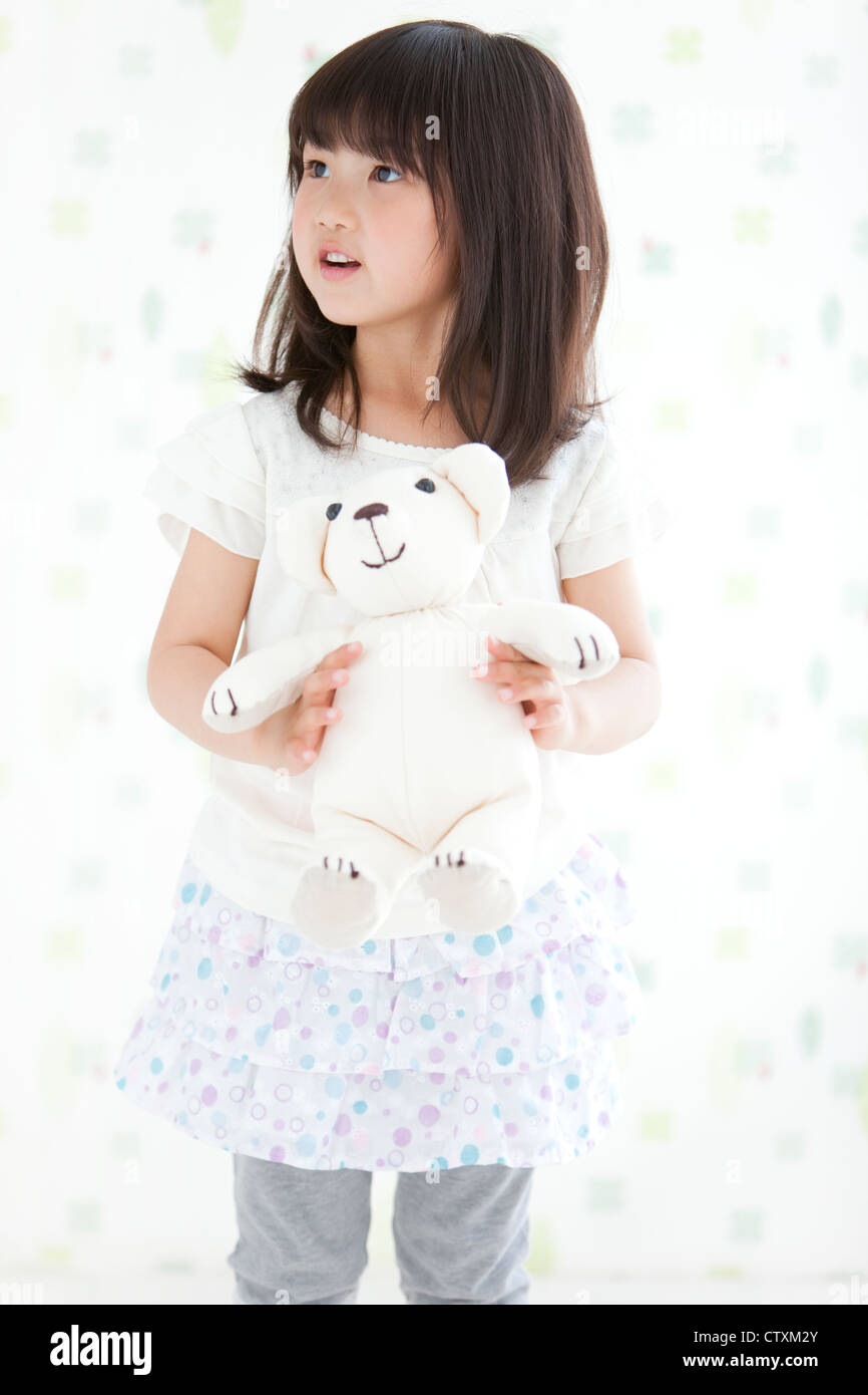A girl holding teddy bear Stock Photo - Alamy