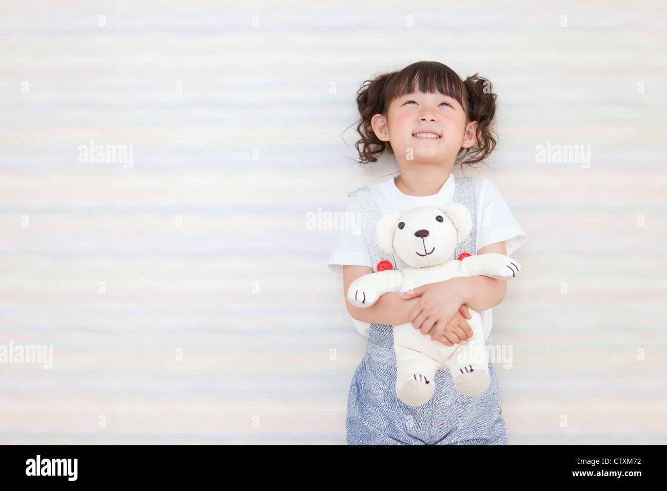 A girl holding teddy bear Stock Photo - Alamy