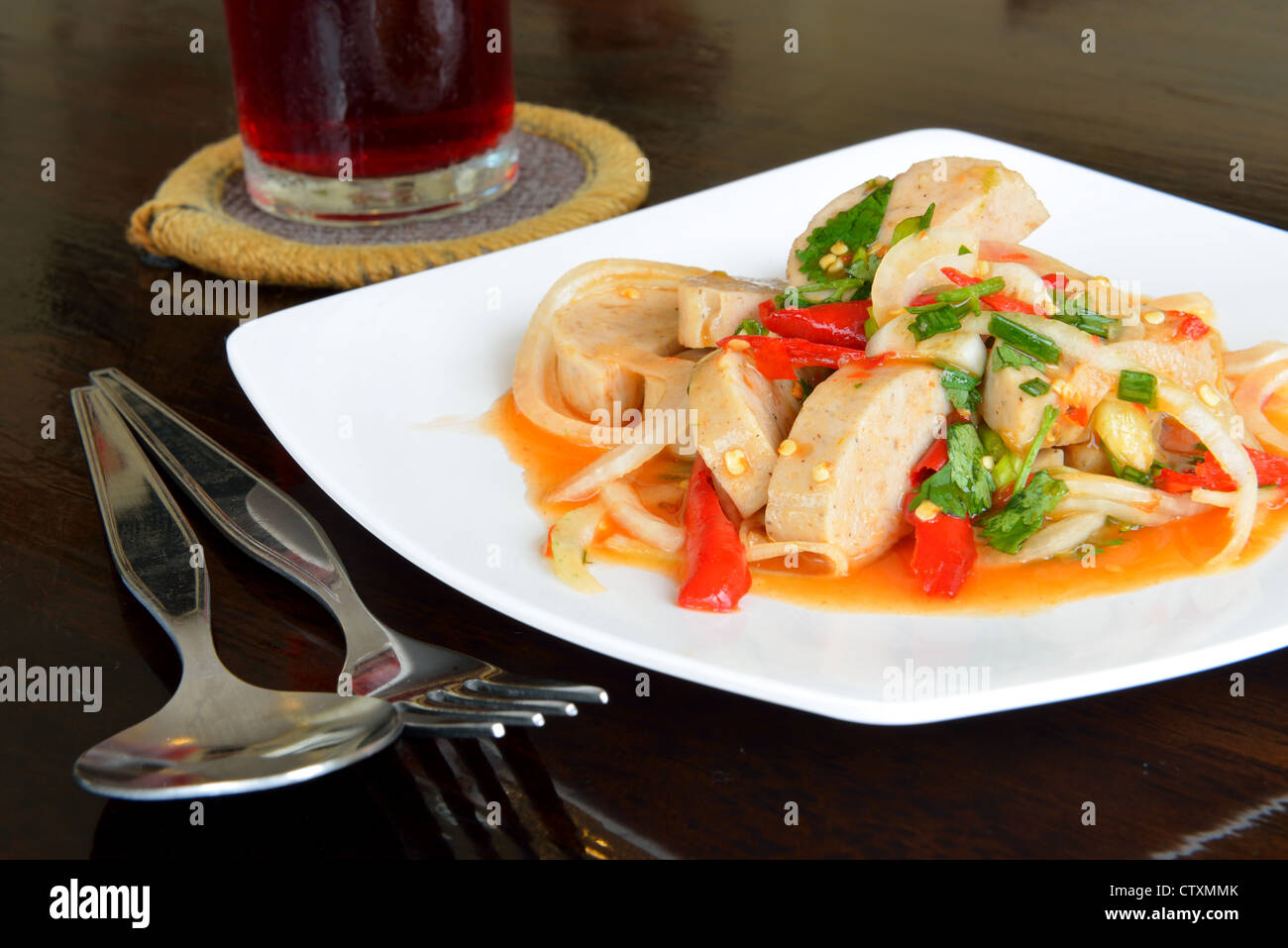 Thai food call 'Mince pork spicy salad' is served on the wooden black table. Stock Photo