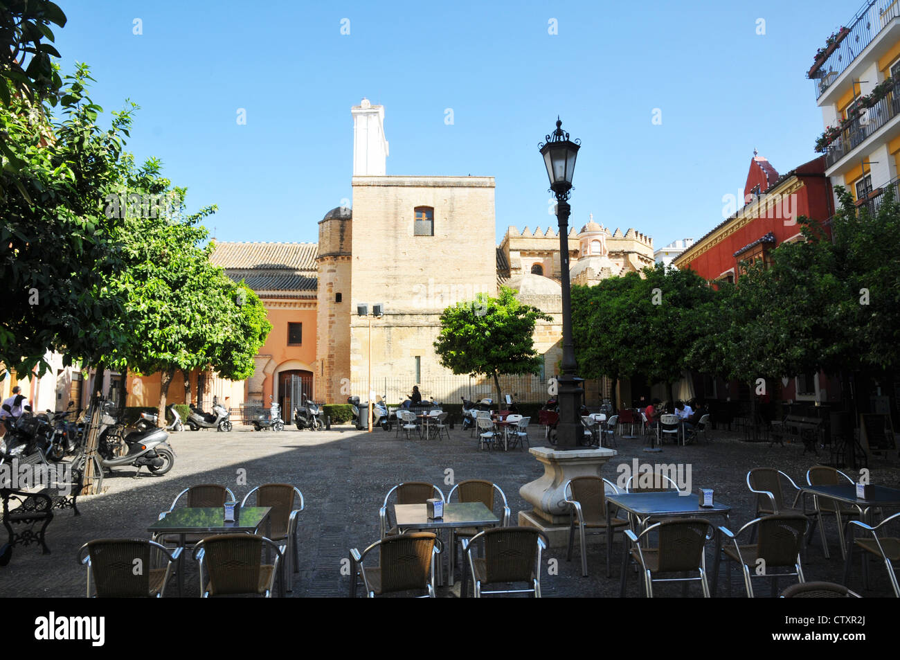 Tables and chairs in square, peaceful space, classic spanish