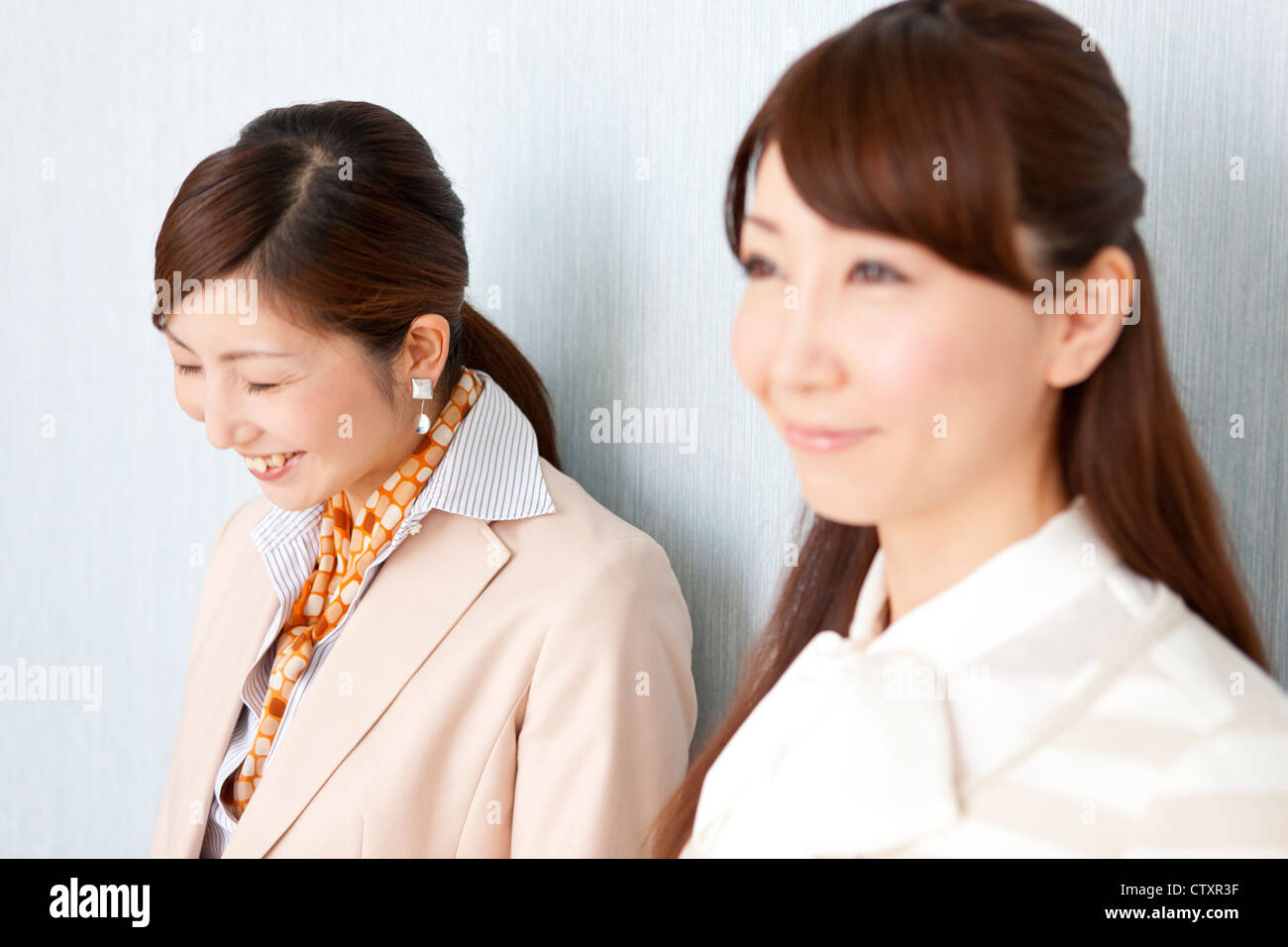 Two young smiling women hi-res stock photography and images - Alamy