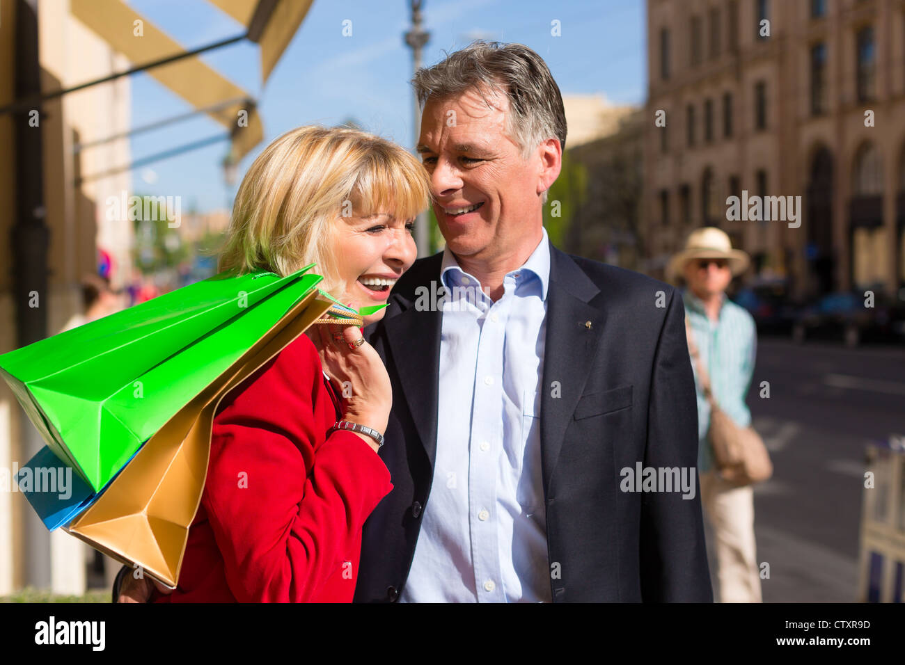 Senior man walking shopping bag hi-res stock photography and images - Alamy