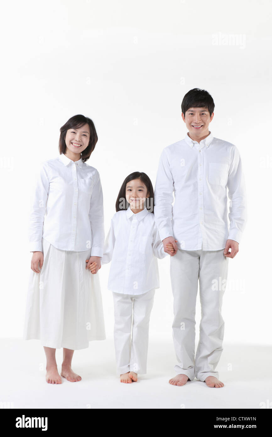 A family in white shirt Stock Photo - Alamy