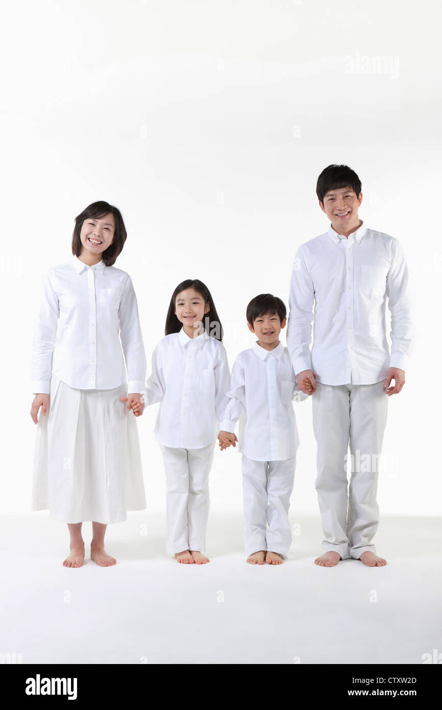A family holding hands together Stock Photo - Alamy