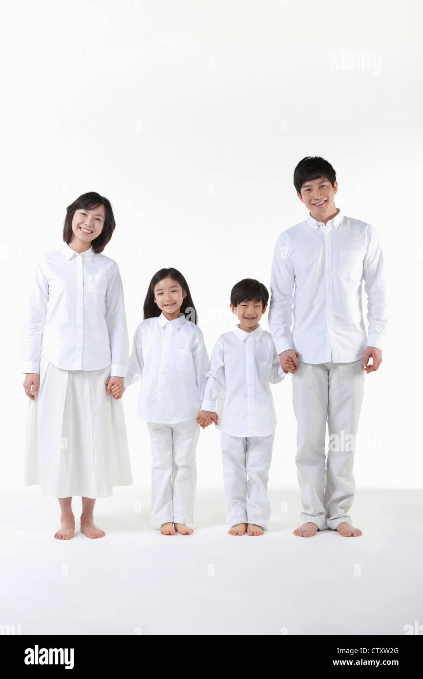 A family holding hands together Stock Photo - Alamy