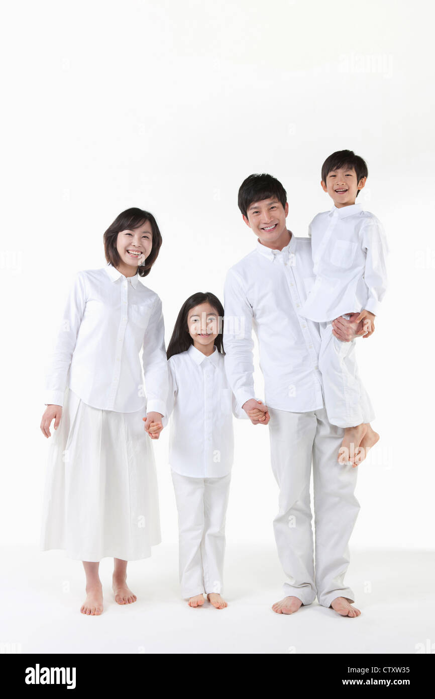 A family holding hands together Stock Photo - Alamy