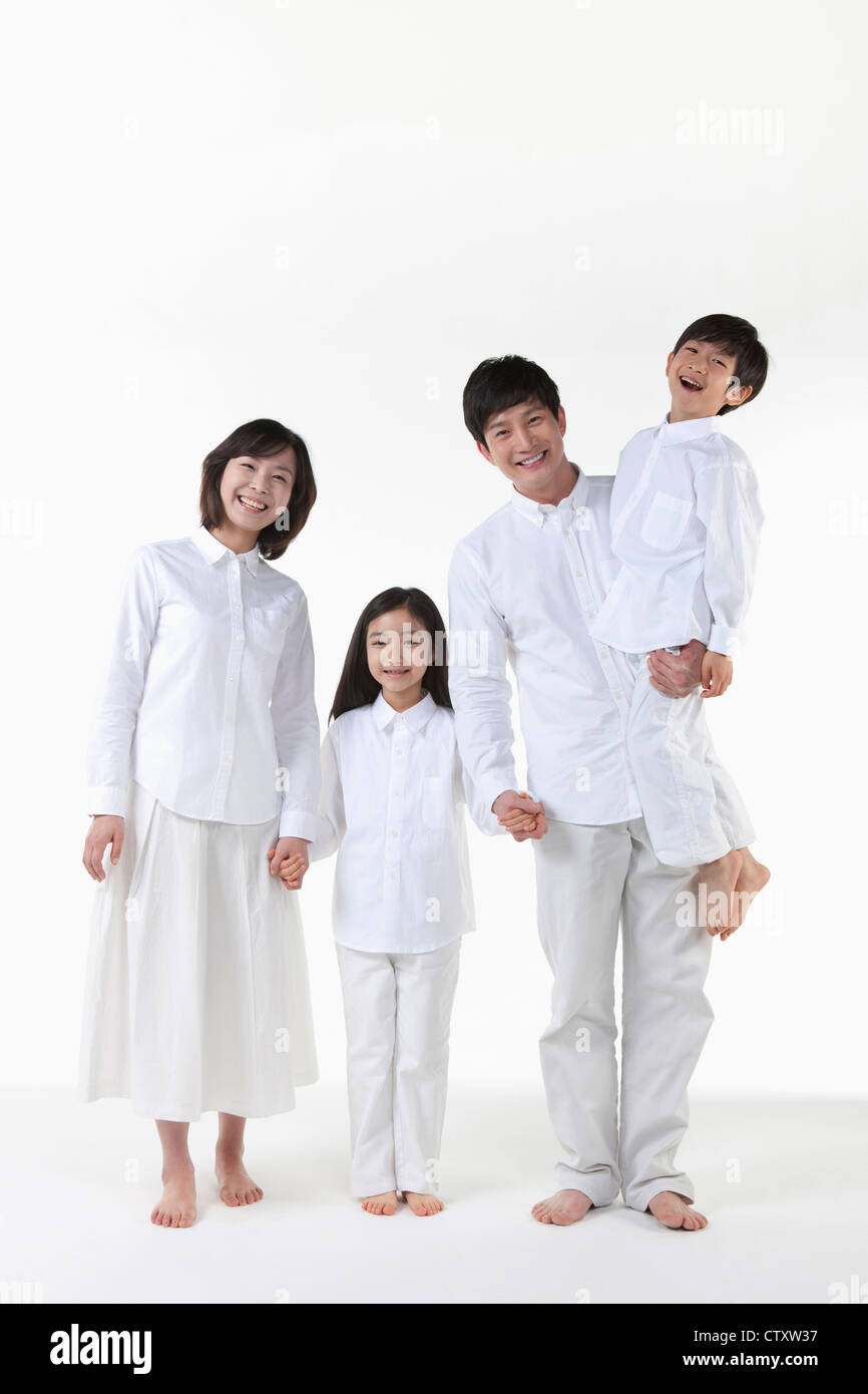 A family holding hands together Stock Photo - Alamy
