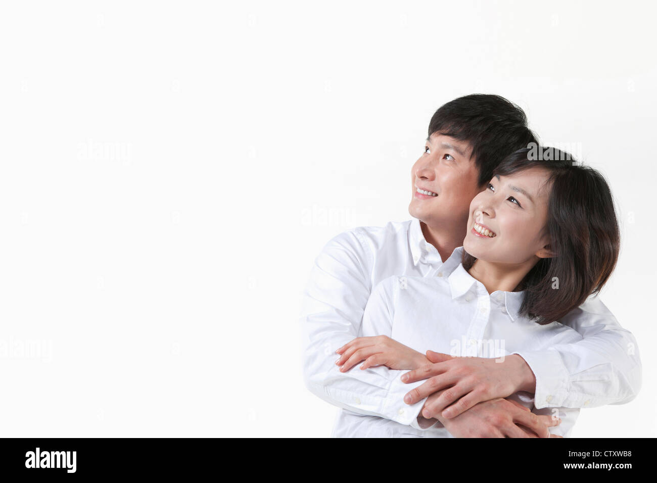 A couple hugging together Stock Photo - Alamy