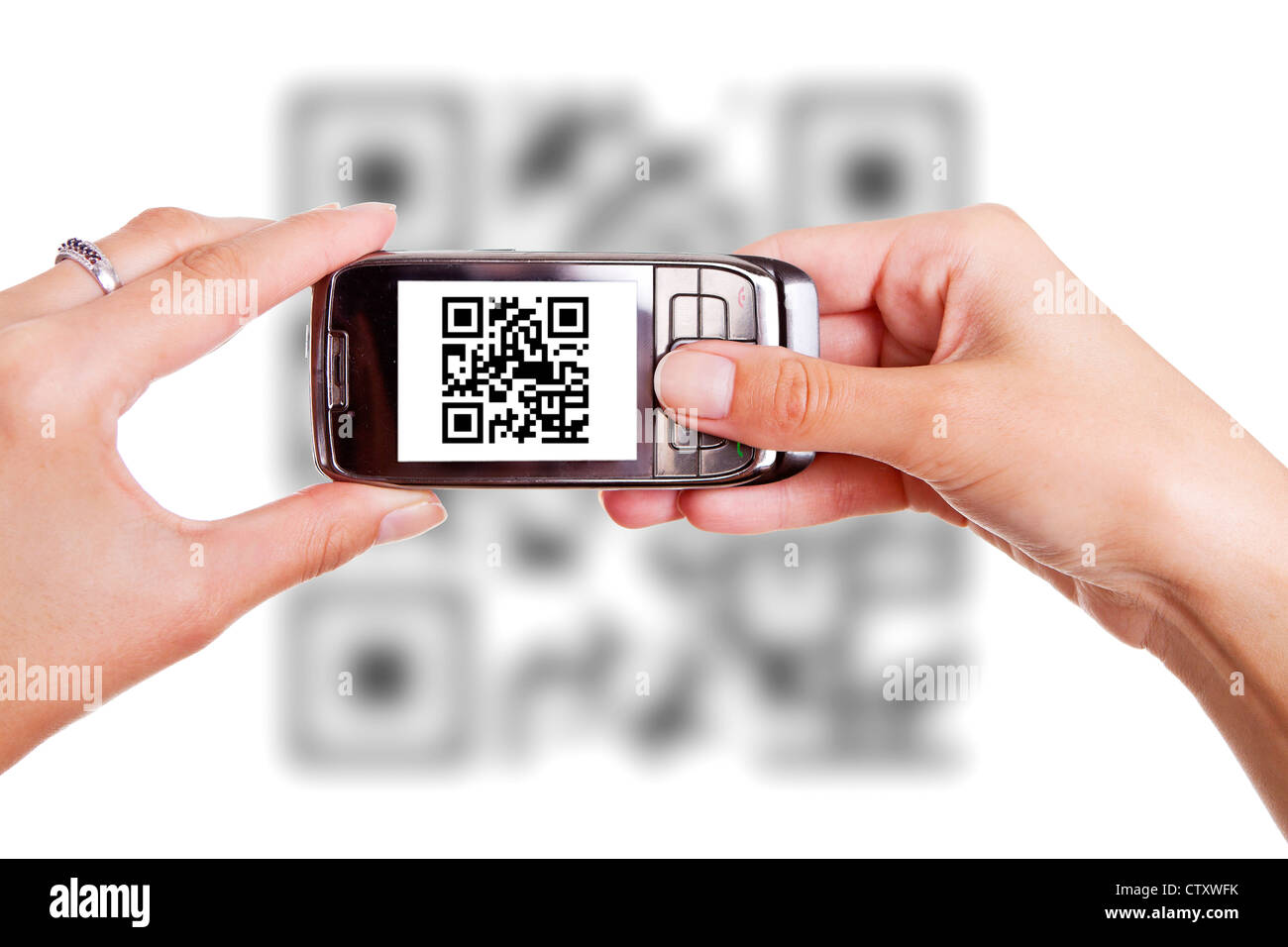 Human hands holding smart phone and scanning QR code Stock Photo