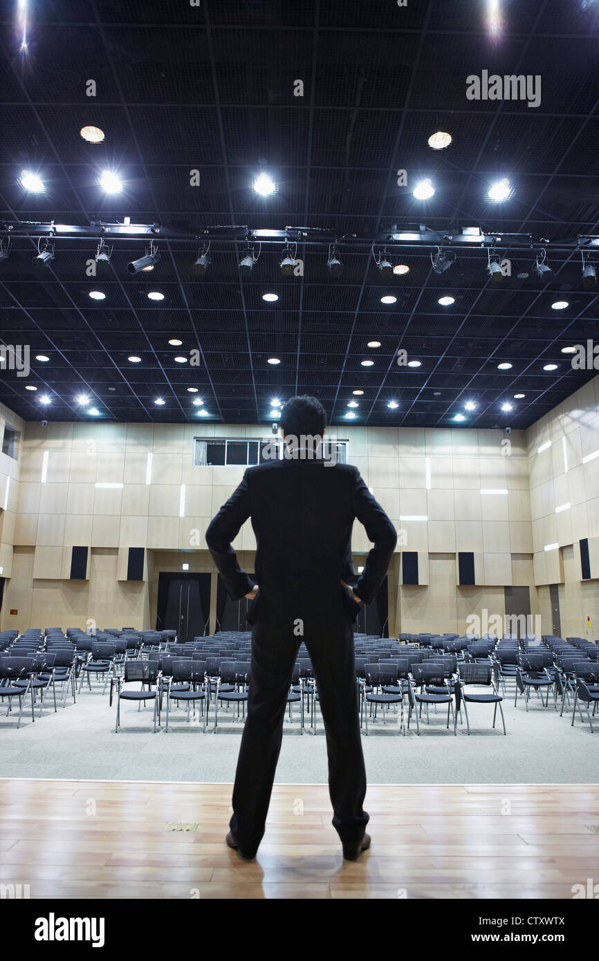 A businessman standing on the stage Stock Photo