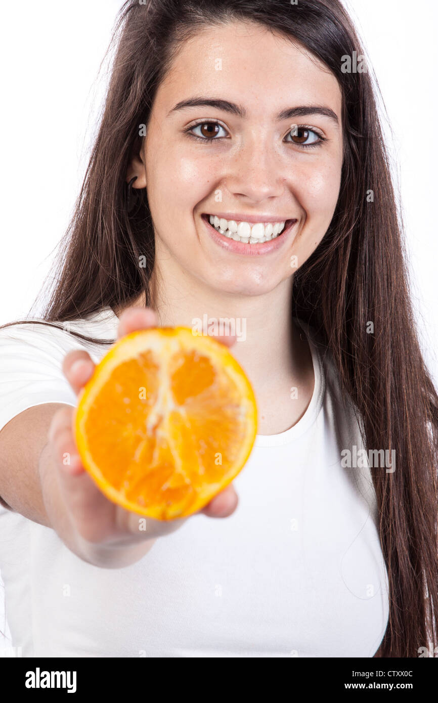 Young woman holding a orange Stock Photo - Alamy
