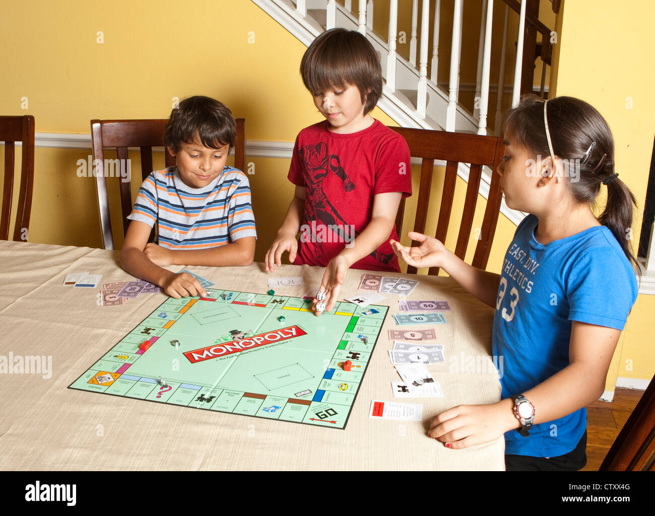 Multi Ethnic Group Of Friends Hispanic And Asian Play Board Game