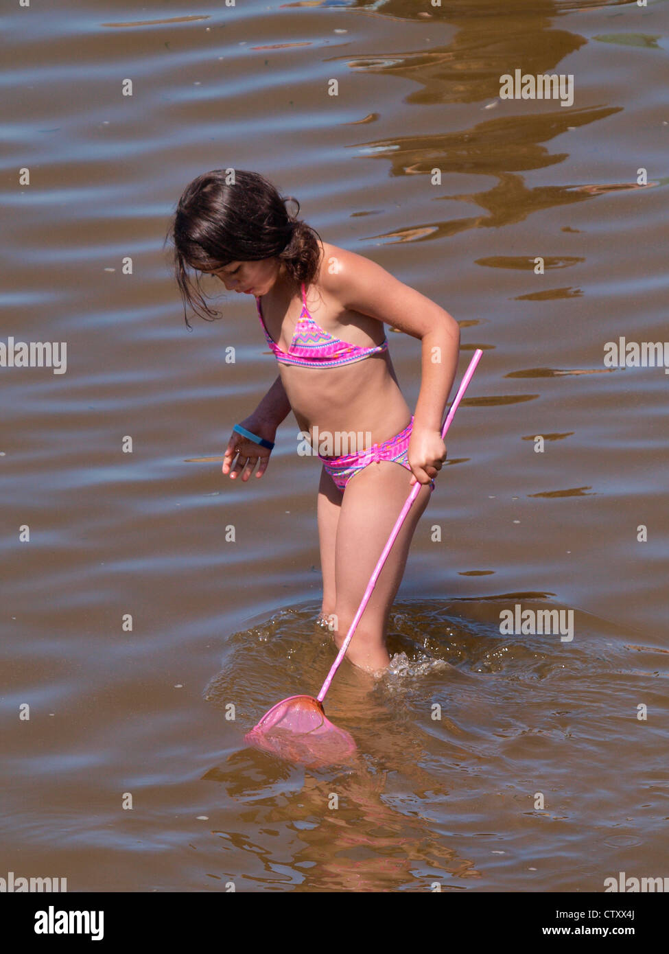 Holiday Fun, Young girl with net, Cornwall, UK Stock Photo