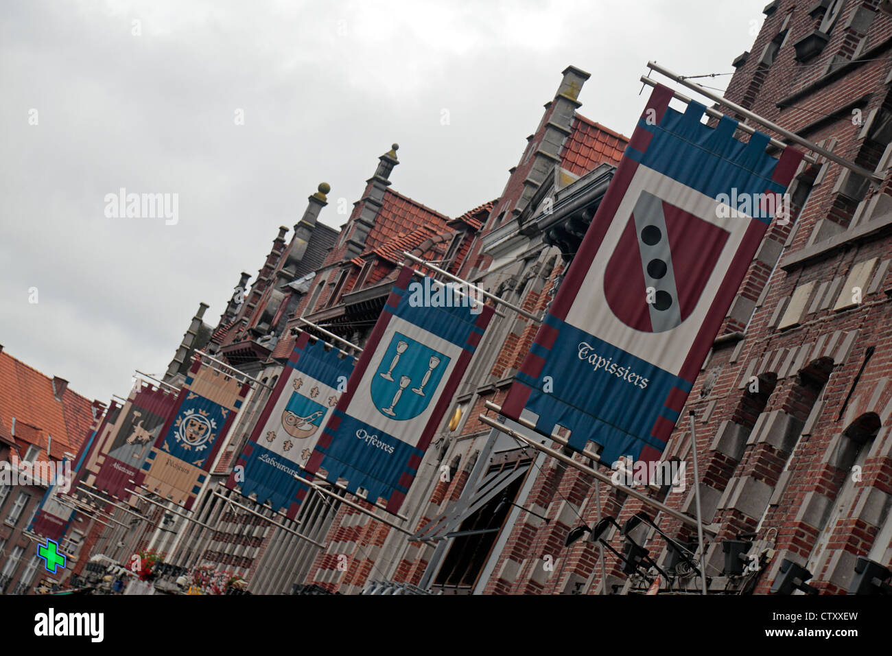 Line of Guild banners flying over Grand Place in Tournai, Hainaut, Belgium. Stock Photo