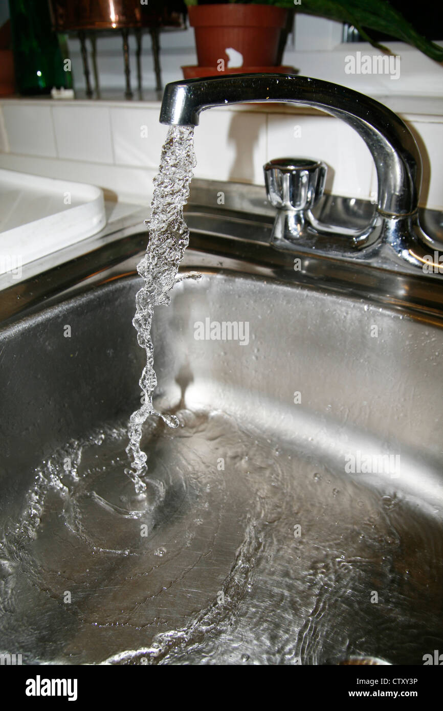Kitchen tap water running Worcester Worcestershire England UK Stock