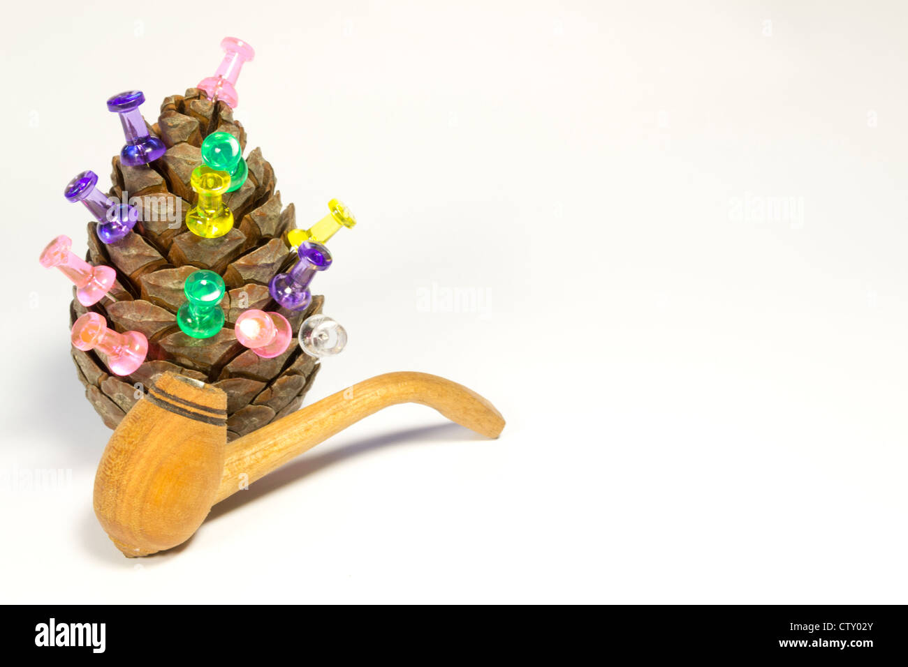 cone with a pipe for smoking are on paper Stock Photo Alamy