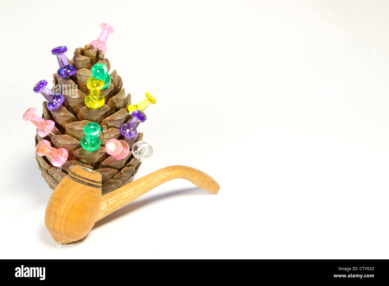 cone with a pipe for smoking are on paper Stock Photo Alamy