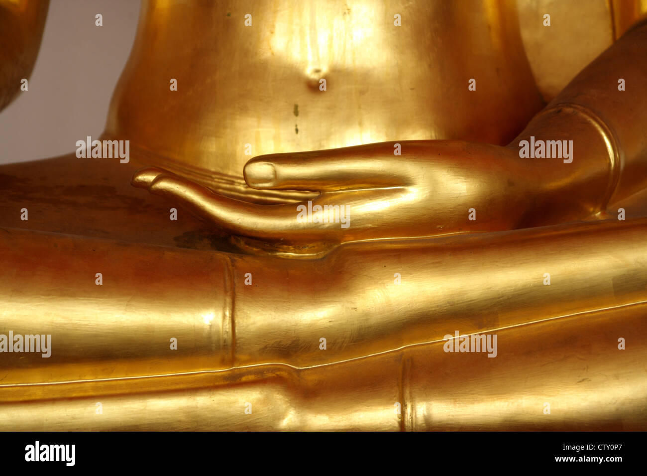 Hand of Golden Buddhist statue on leg Stock Photo Alamy